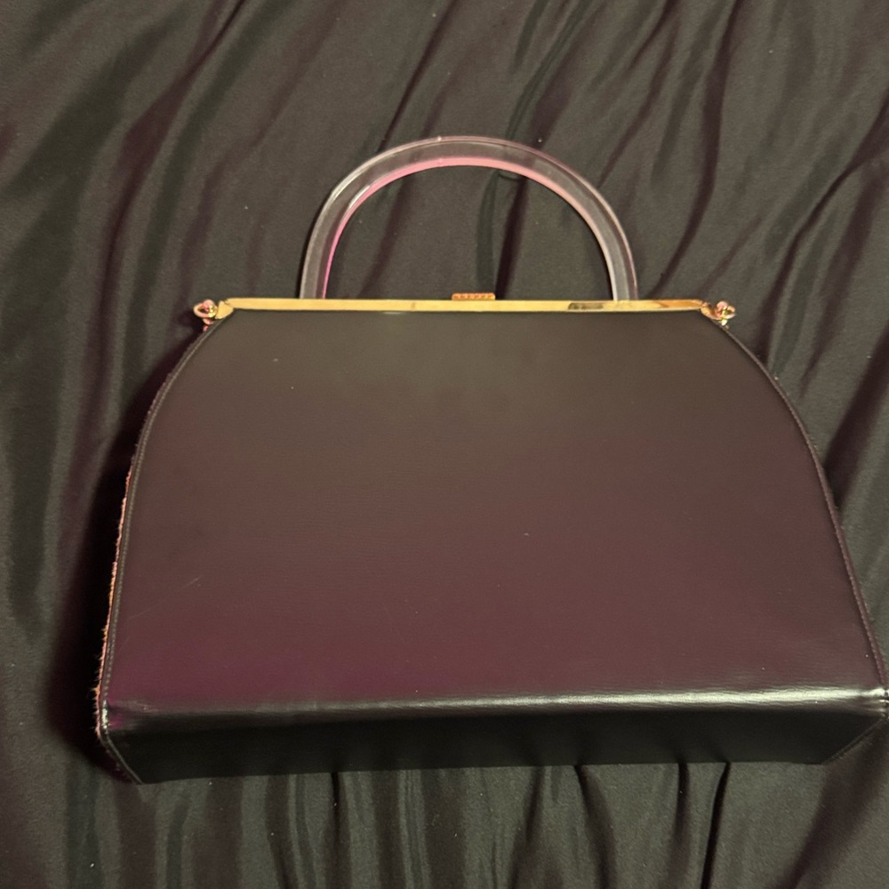 Elegant Black Handbag with Gold Accents